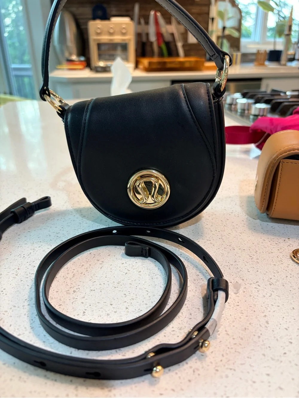lululemon athletica Black Leather Crossbody with Gold Logo Accent